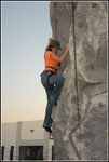 Olivia O'Lovely climbs the wall at the Coming Home Release Party